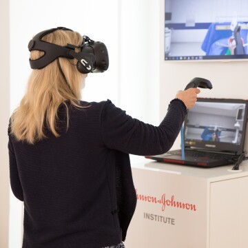 A woman engaging in a virtual reality medical training at the Johnson & Johnson Institute