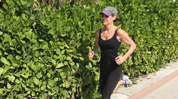 A photo of Cat Oyler running outside