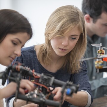A photo of people working with drones