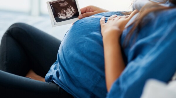 Pregnant woman looking at sonogram