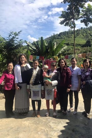 The UNICEF Vietnam and Johnson & Johnson teams learn about the challenges for Tày midwives and mothers in Vietnam; from left to right, Dr. Phạm Thị Kim Thoa (Provincial Reproductive Health Center, Lao Cai province), Joy Marini (Johnson & Johnson), Vàng Tả Mẩy (Nậm Giang 2 village ethnic minority midwife), Chảo Tả Mẩy (mother), Nguyen Thu Hằng (Johnson & Johnson Vietnam), Bùi Thị Hồng Nguyện (community midwife) and Dr. Pham Bich Ha (UNICEF consultant)