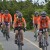 A photo of Carmen and Mike with Road to Victories participants on a training ride